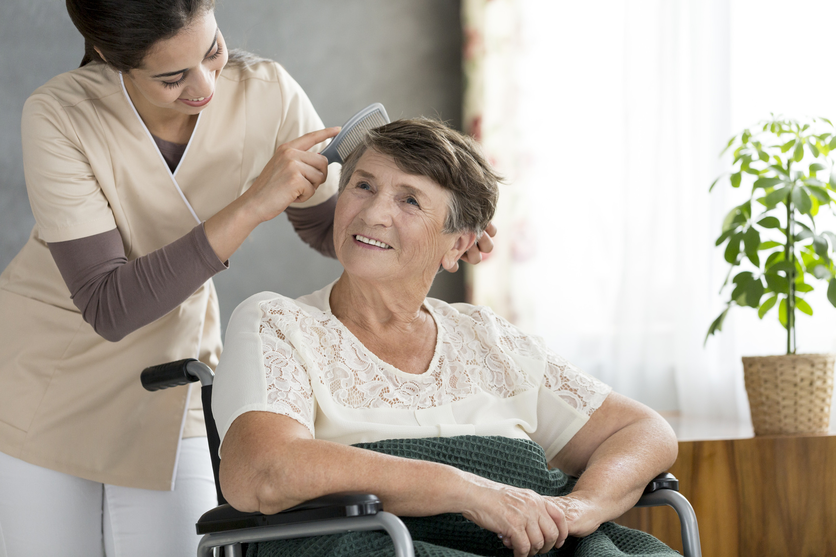 https://fwhealthcare.biz/wp-content/uploads/2023/06/Caregiver-Brushing-Elderly-Womans-Hair.jpg